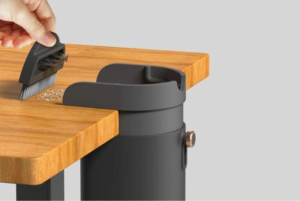 Keep your desk, countertop, and study space spotlessly clean with the Clip-On Tabletop Mini Trash Can with Integrated Cleaning Brush. Designed for modern, space-conscious setups, this compact dustbin securely clips onto the edge of any table, desk, or kitchen counter, keeping surface waste off your workspace without taking up valuable desk real estate. Equipped with a custom-fit mini cleaning brush that snaps directly onto the bin, this 2-in-1 desktop cleaning kit allows you to effortlessly sweep away eraser shavings, paper scraps, breadcrumbs, and small office debris in seconds.